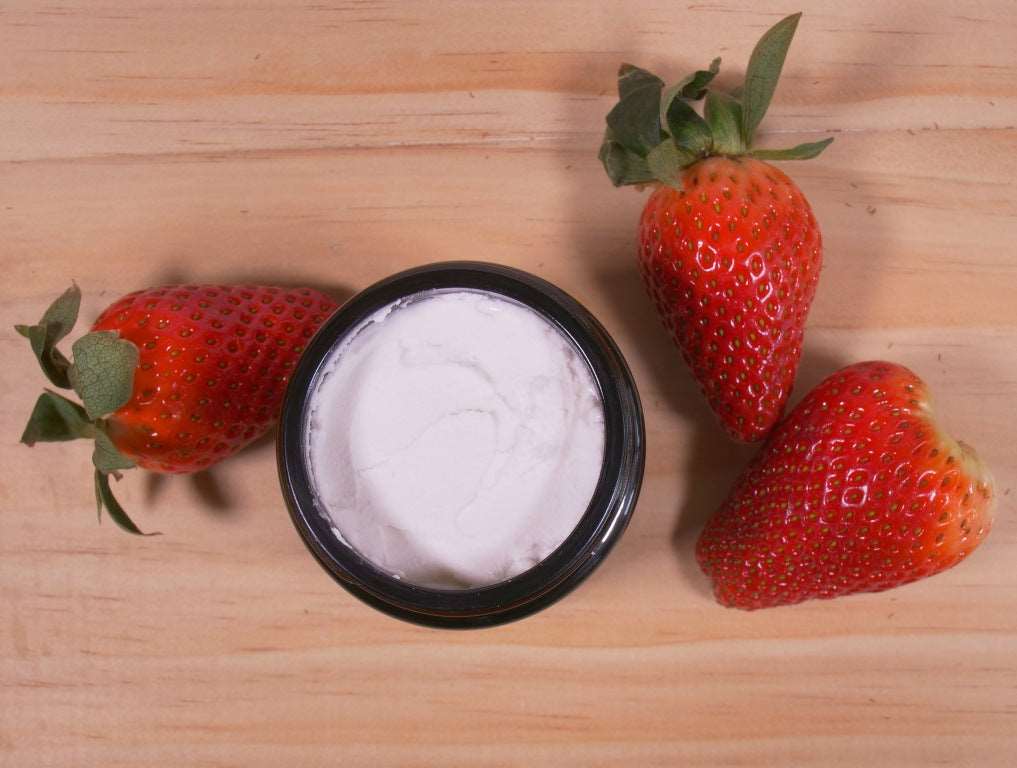 Open jar of Maxwell & McIntyre natural strawberry toothpaste for kids
